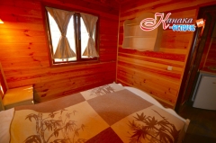 Спальня в коттедже eco village в Канаке